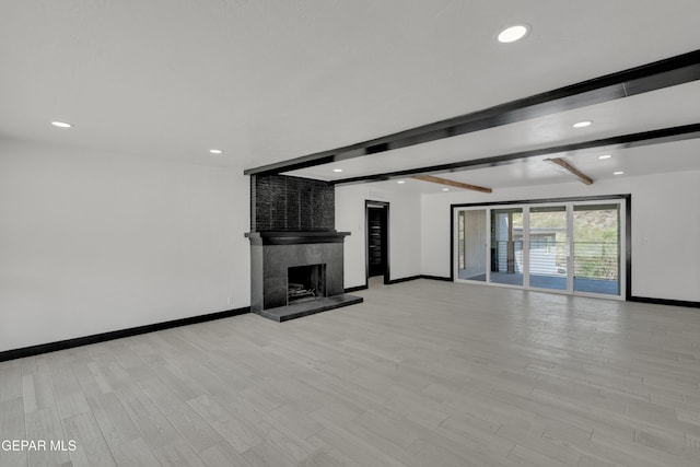 3116 Titanic Ave, El Paso, TX 79904 - unfurnished living room with beam ceiling, a premium fireplace, recessed lighting, and light wood-type flooring