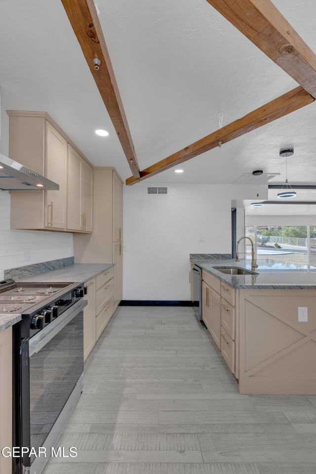 3116 Titanic Ave, El Paso, TX 79904 - kitchen featuring appliances with stainless steel finishes, beam ceiling, light stone counters, cream cabinetry, and recessed lighting
