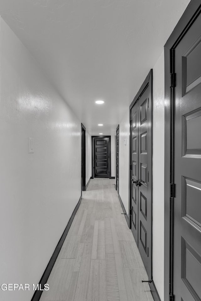 3116 Titanic Ave, El Paso, TX 79904 - corridor with baseboards and recessed lighting