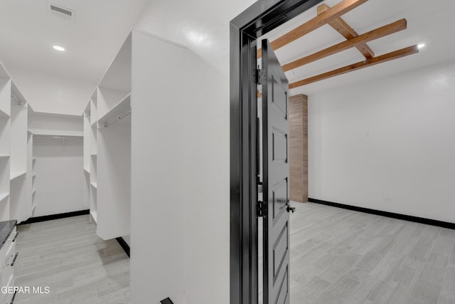 3116 Titanic Ave, El Paso, TX 79904 - walk in closet featuring light wood-style flooring