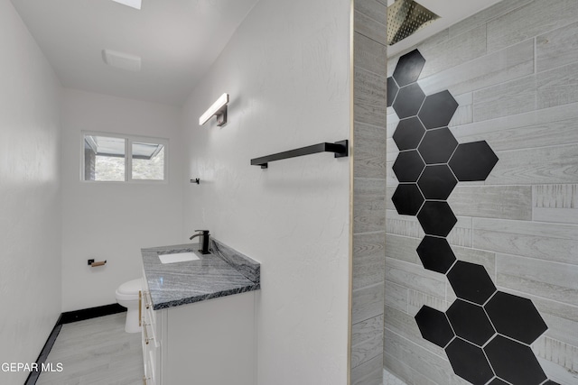 3116 Titanic Ave, El Paso, TX 79904 - full bathroom featuring vanity and tiled shower