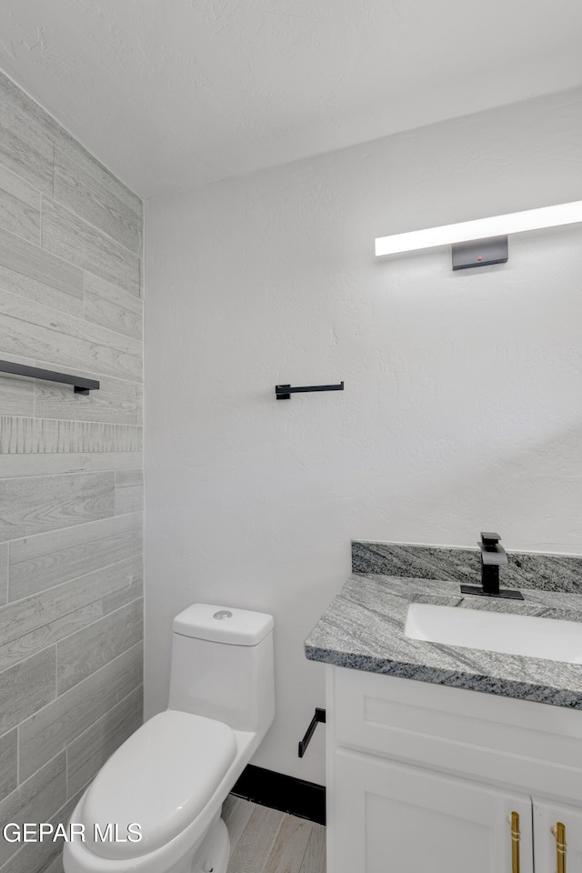 3116 Titanic Ave, El Paso, TX 79904 - bathroom featuring vanity and wood finished floors