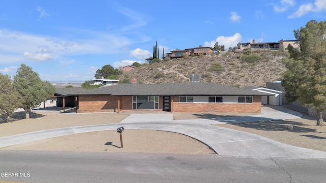 3116 Titanic Ave, El Paso, TX 79904 - ranch-style home with brick siding and concrete driveway
