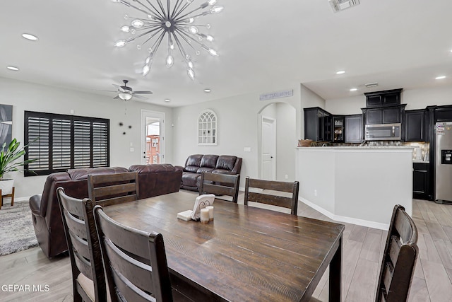 13120 Wesleyan, El Paso, TX 79928 - dining area with arched walkways, ceiling fan, recessed lighting, a chandelier, and light wood finished floors