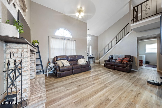 5823 Chippendale Ave, El Paso, TX 79934 - living area with a towering ceiling, stairway, wood finished floors, and ceiling fan