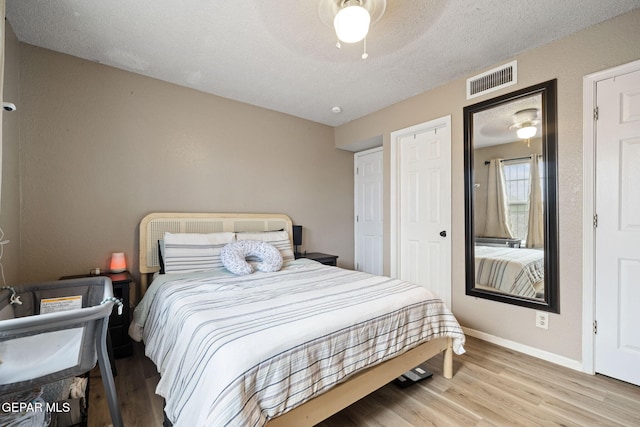 5823 Chippendale Ave, El Paso, TX 79934 - bedroom with wood finished floors, a textured ceiling, and ceiling fan