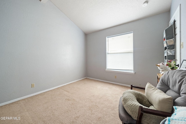 5823 Chippendale Ave, El Paso, TX 79934 - sitting room featuring light carpet and vaulted ceiling