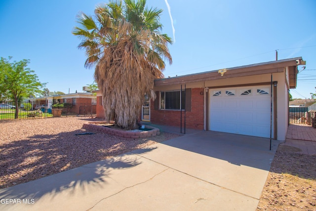 10324 Shoshone St, El Paso, TX 79924 - ranch-style house with an attached garage, driveway, and brick siding
