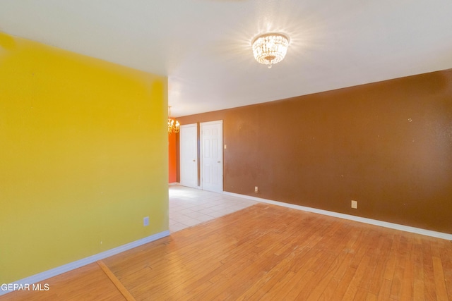10324 Shoshone St, El Paso, TX 79924 - spare room featuring a chandelier and light wood finished floors