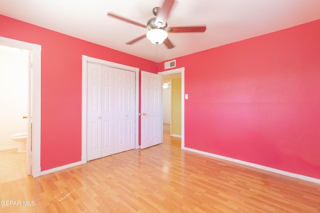 10324 Shoshone St, El Paso, TX 79924 - unfurnished bedroom with wood finished floors, a closet, and a ceiling fan