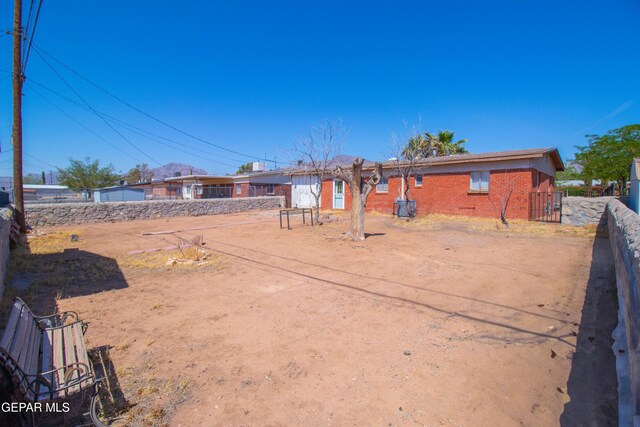 10324 Shoshone St, El Paso, TX 79924 - rear view of house featuring brick siding