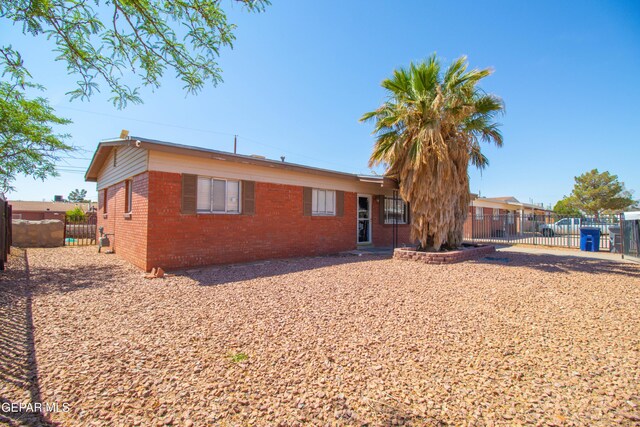 10324 Shoshone St, El Paso, TX 79924 - view of front of house with brick siding and a gate