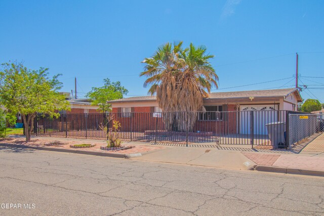 10324 Shoshone St, El Paso, TX 79924 - ranch-style house featuring a fenced front yard and an attached garage