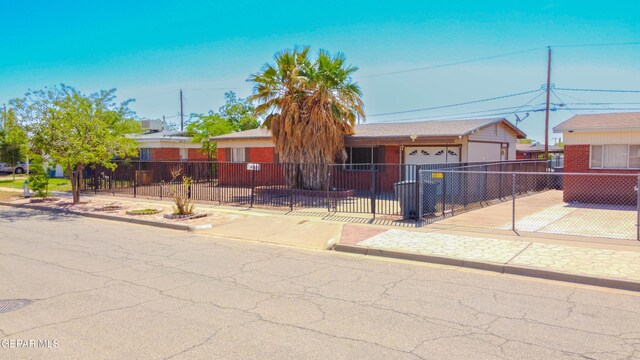 10324 Shoshone St, El Paso, TX 79924 - ranch-style home featuring a fenced front yard, an attached garage, and concrete driveway
