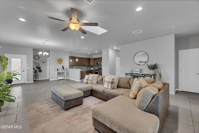 203 Bretby Pl, El Paso, TX 79928 - living area featuring a ceiling fan, recessed lighting, a chandelier, a skylight, and light tile patterned floors