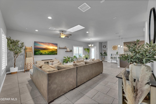 203 Bretby Pl, El Paso, TX 79928 - living area featuring a skylight, light tile patterned flooring, ceiling fan, recessed lighting, and a chandelier