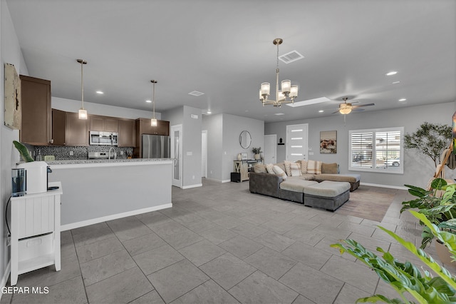 203 Bretby Pl, El Paso, TX 79928 - living room with ceiling fan, a chandelier, and recessed lighting
