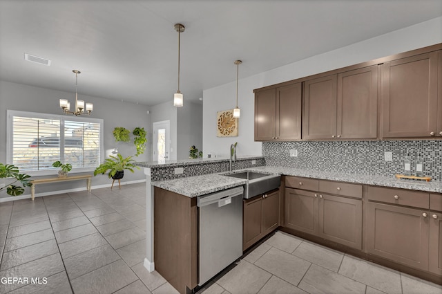 203 Bretby Pl, El Paso, TX 79928 - kitchen featuring stainless steel dishwasher, decorative backsplash, light tile patterned flooring, and a peninsula