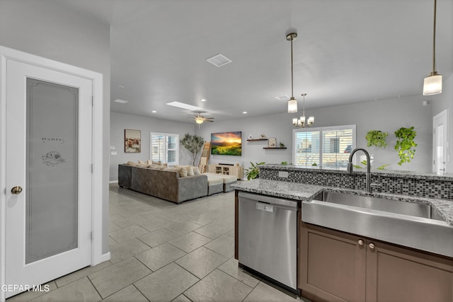 203 Bretby Pl, El Paso, TX 79928 - kitchen featuring stainless steel dishwasher, hanging light fixtures, ceiling fan, light tile patterned floors, and light stone countertops
