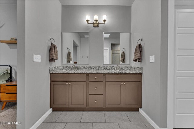 203 Bretby Pl, El Paso, TX 79928 - full bathroom with double vanity, tile patterned flooring, and a shower