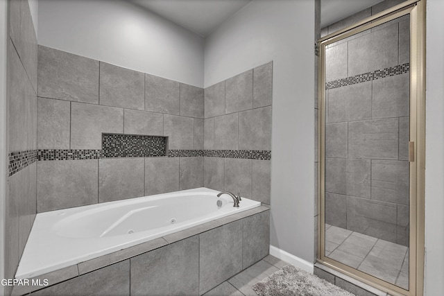 203 Bretby Pl, El Paso, TX 79928 - bathroom featuring a tub with jets, a stall shower, and tile patterned floors