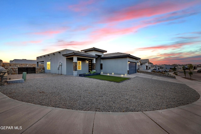 203 Bretby Pl, El Paso, TX 79928 - view of front of home featuring concrete driveway, an attached garage, and stucco siding