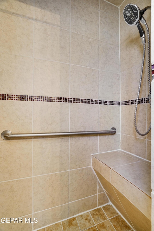 10317 Wilshire Dr, El Paso, TX 79924 - bathroom featuring a tile shower and tile patterned flooring
