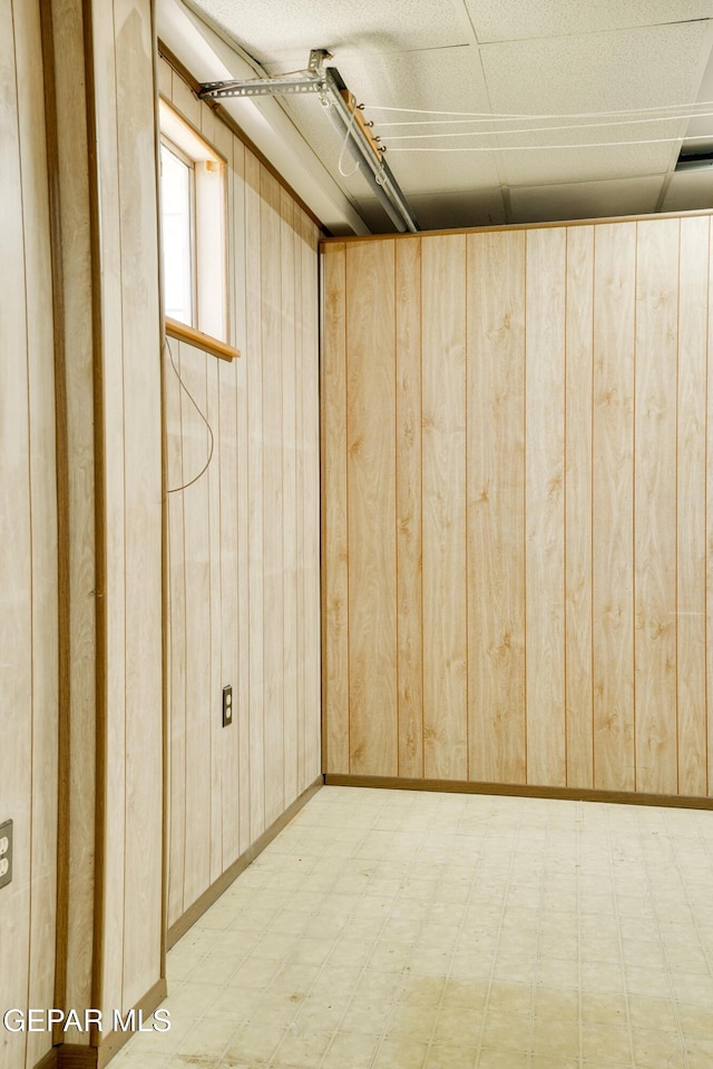 10317 Wilshire Dr, El Paso, TX 79924 - below grade area featuring light floors and wooden walls