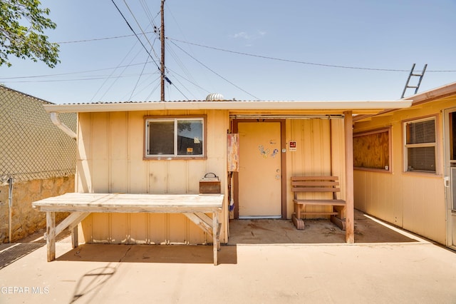 10317 Wilshire Dr, El Paso, TX 79924 - doorway to property with board and batten siding