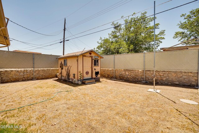 10317 Wilshire Dr, El Paso, TX 79924 - fenced backyard featuring a storage shed
