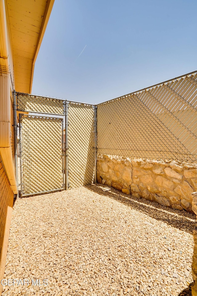 10317 Wilshire Dr, El Paso, TX 79924 - view of yard featuring a gate