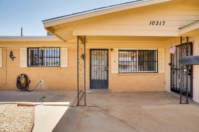 10317 Wilshire Dr, El Paso, TX 79924 - property entrance featuring brick siding