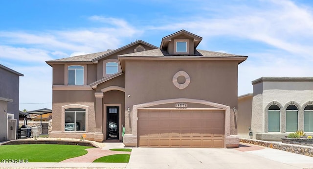 12879 Hidden Grove Dr, El Paso, TX 79938 - mediterranean / spanish-style home featuring driveway, stucco siding, and a garage