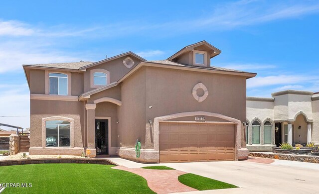 12879 Hidden Grove Dr, El Paso, TX 79938 - view of front facade featuring an attached garage, driveway, and stucco siding