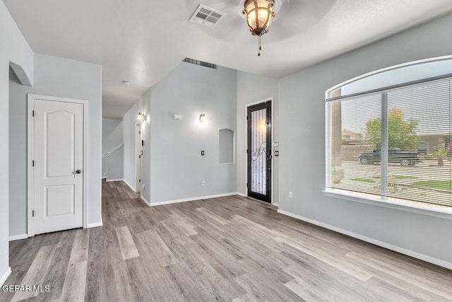 12879 Hidden Grove Dr, El Paso, TX 79938 - unfurnished living room featuring ceiling fan, healthy amount of natural light, and light wood-style flooring
