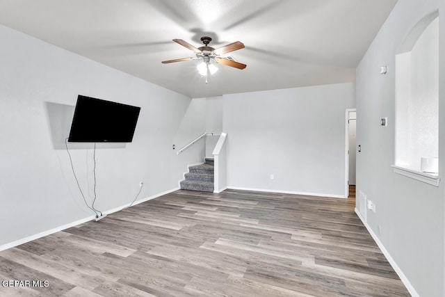 12879 Hidden Grove Dr, El Paso, TX 79938 - unfurnished living room with ceiling fan, stairway, and wood finished floors