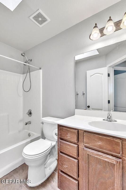 12879 Hidden Grove Dr, El Paso, TX 79938 - bathroom with vanity, washtub / shower combination, and tile patterned flooring