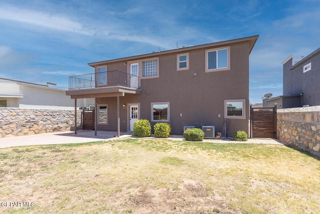 12879 Hidden Grove Dr, El Paso, TX 79938 - rear view of house featuring a balcony, a patio area, stucco siding, and a gate