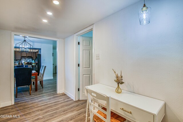 350 Thunderbird Dr Unit 59, El Paso, TX 79912 - hallway with a chandelier, wood finished floors, and recessed lighting