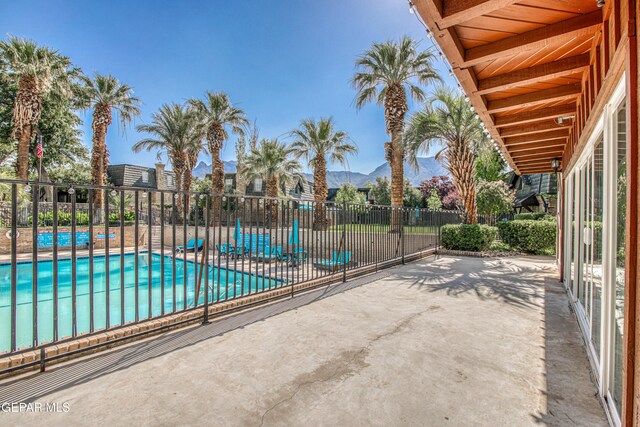 350 Thunderbird Dr Unit 59, El Paso, TX 79912 - community pool featuring a patio and a mountain view
