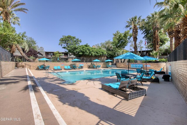 350 Thunderbird Dr Unit 59, El Paso, TX 79912 - community pool featuring a patio