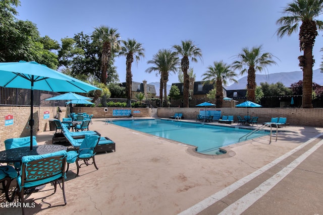 350 Thunderbird Dr Unit 59, El Paso, TX 79912 - community pool featuring a patio and a mountain view