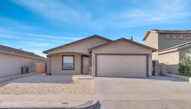 14197 Ranier Point Dr, El Paso, TX 79938 - view of front of home with stucco siding, an attached garage, and driveway