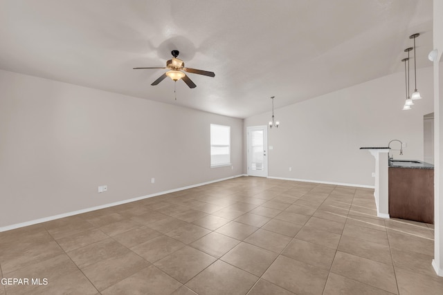 14197 Ranier Point Dr, El Paso, TX 79938 - unfurnished living room featuring a ceiling fan and light tile patterned flooring