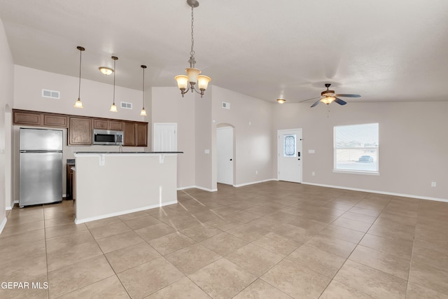 14197 Ranier Point Dr, El Paso, TX 79938 - kitchen with stainless steel appliances, a ceiling fan, and light tile patterned flooring