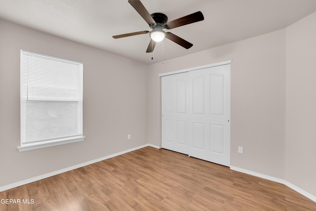 14197 Ranier Point Dr, El Paso, TX 79938 - unfurnished bedroom with light wood-style flooring, a closet, and ceiling fan