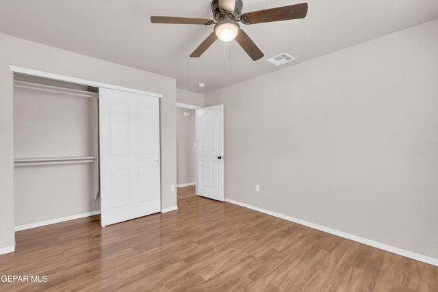 14197 Ranier Point Dr, El Paso, TX 79938 - unfurnished bedroom featuring a closet, wood finished floors, and ceiling fan