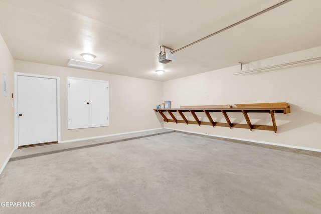 14197 Ranier Point Dr, El Paso, TX 79938 - garage with a garage door opener and baseboards
