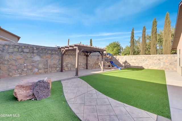 14197 Ranier Point Dr, El Paso, TX 79938 - fenced backyard featuring a playground, a pergola, and a patio