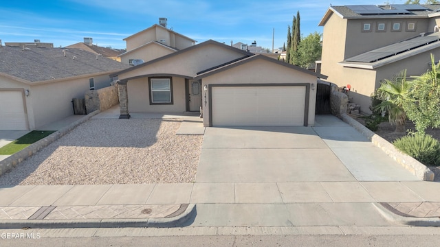 14197 Ranier Point Dr, El Paso, TX 79938 - view of front of property with an attached garage, stucco siding, and driveway